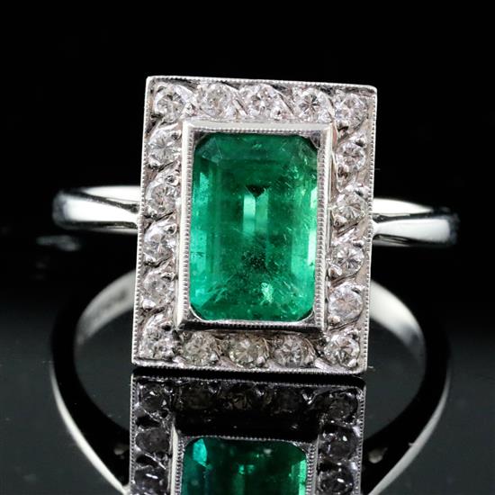An Art Deco style 18ct white gold, emerald and diamond tablet cluster ring, size O.